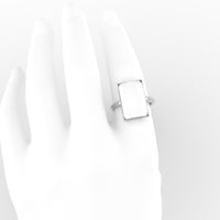 Emerald-cut breastmilk ring in 18K white gold, shown worn on a hand