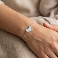 Ultrasound Silhouette Bracelet in 18K white gold, worn on the wrist