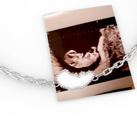 The bracelet charm shaped to match the exact outline of the client's own ultrasound scan